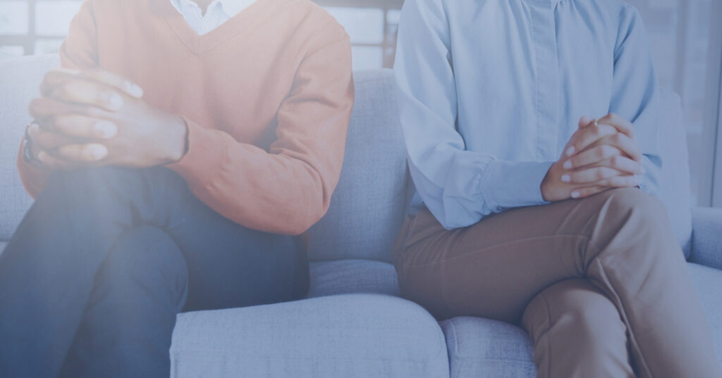 Couples seated apart, symbolizing relationship struggles and the need for counseling to reconnect.